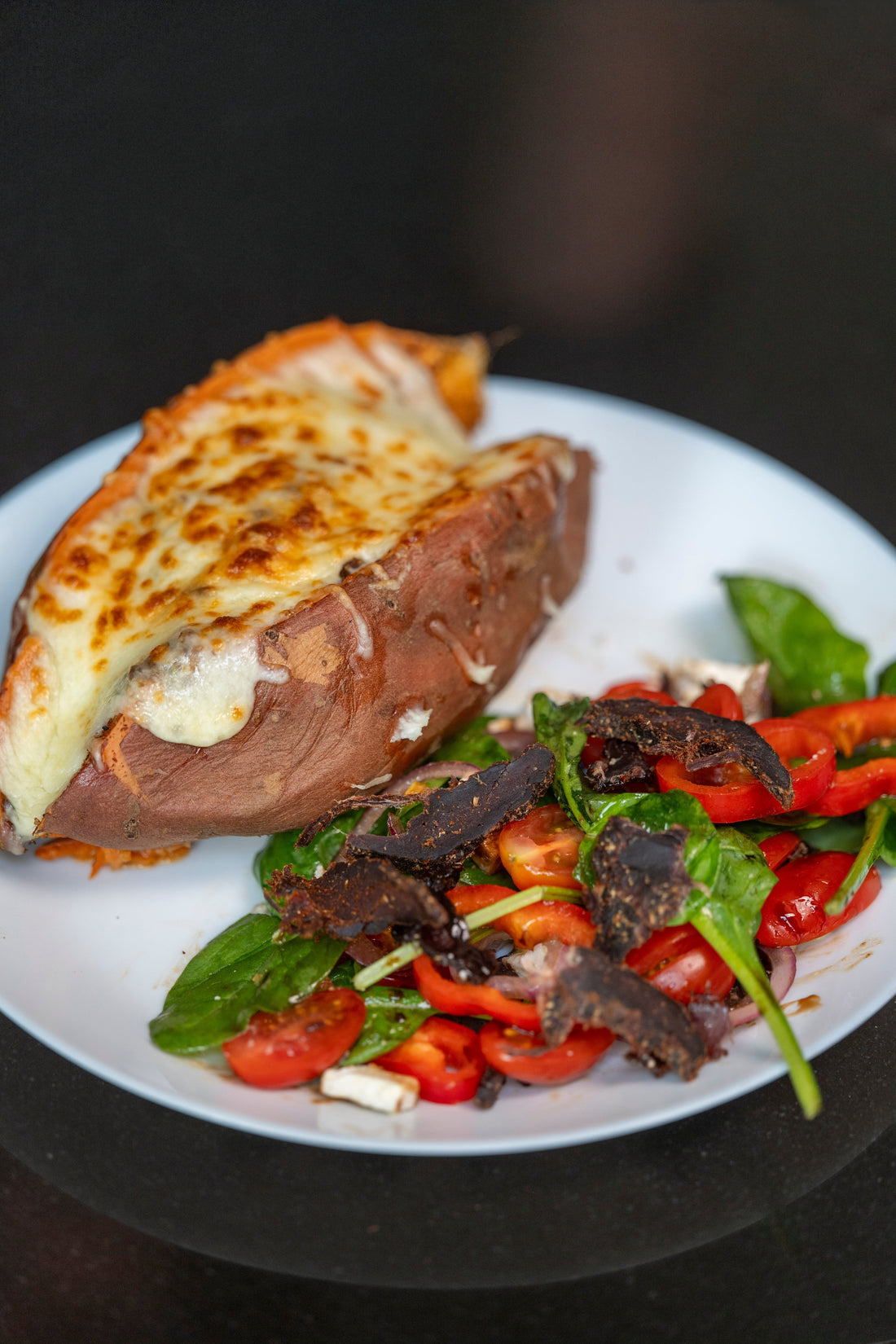 Biltong Powder Loaded Sweet Potato with Melted Cheese and Salad - Runder Biltong 