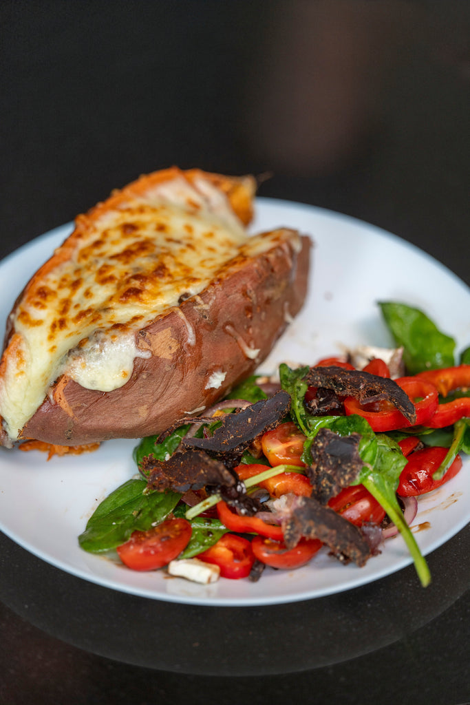 Biltong Powder Loaded Sweet Potato with Melted Cheese and Salad - Runder Biltong 